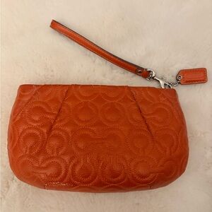 Coach Orange Embossed Leather Wristlet Pouch